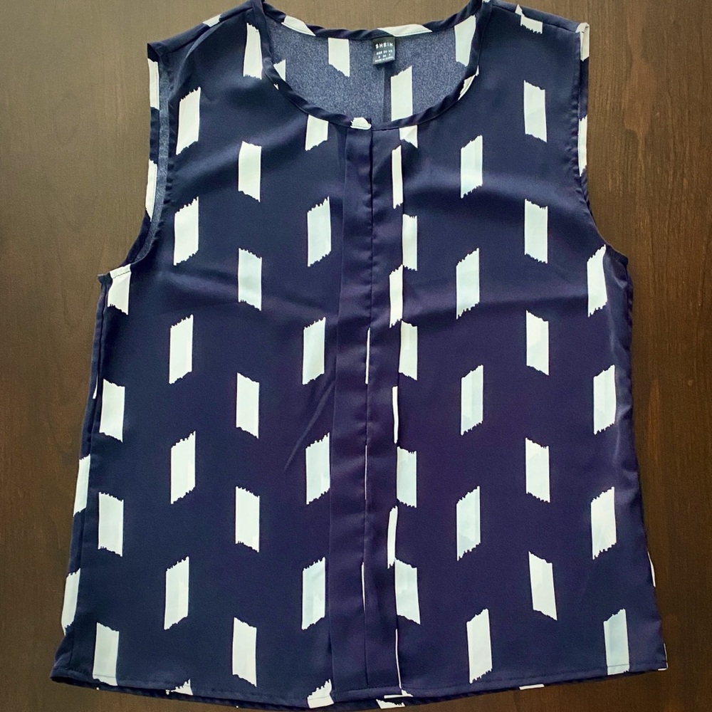 Women’s Size small sleeveless blouse.